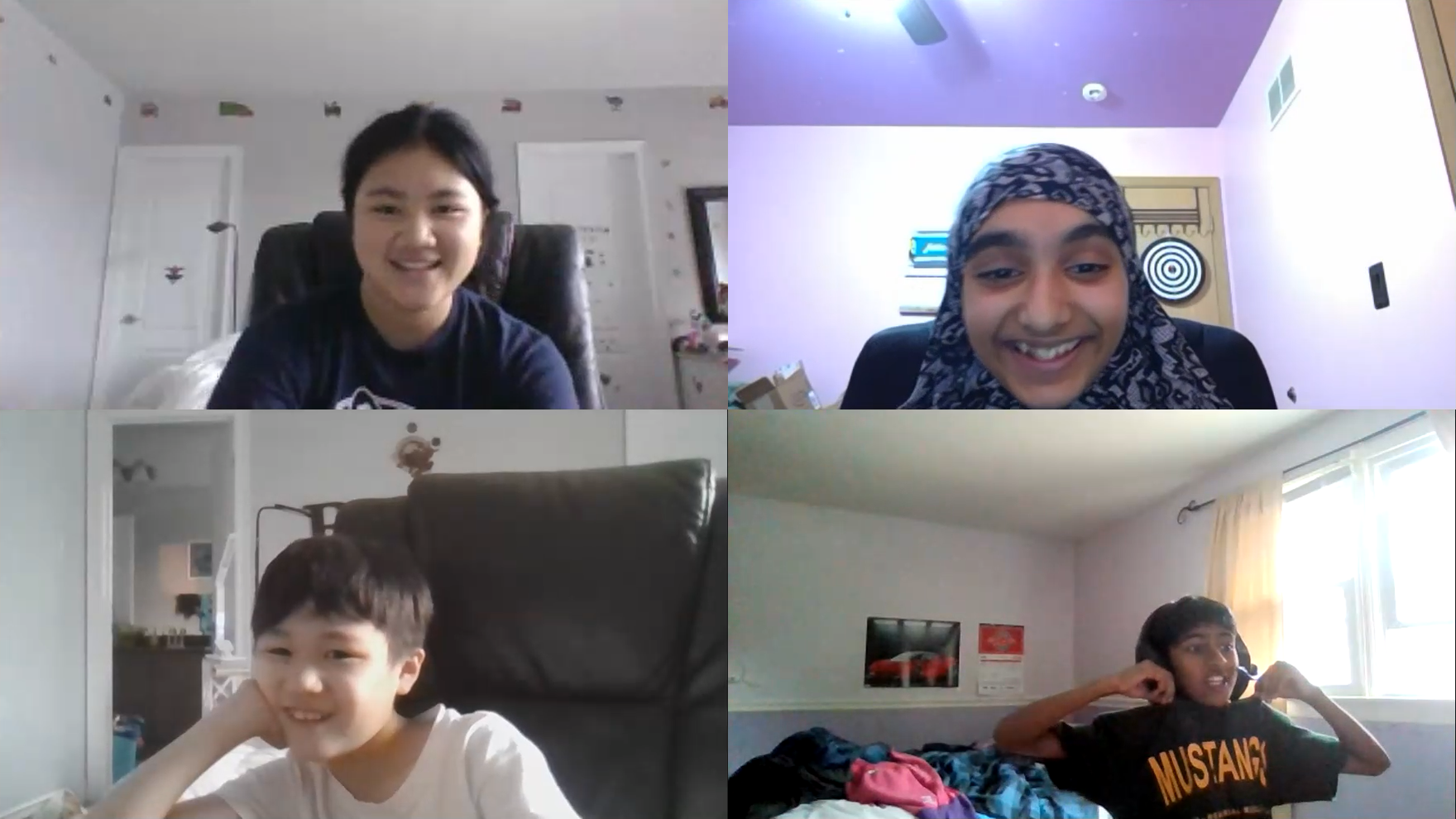 Four smiling students joining an online call from home, arranged in a two-by-two grid.